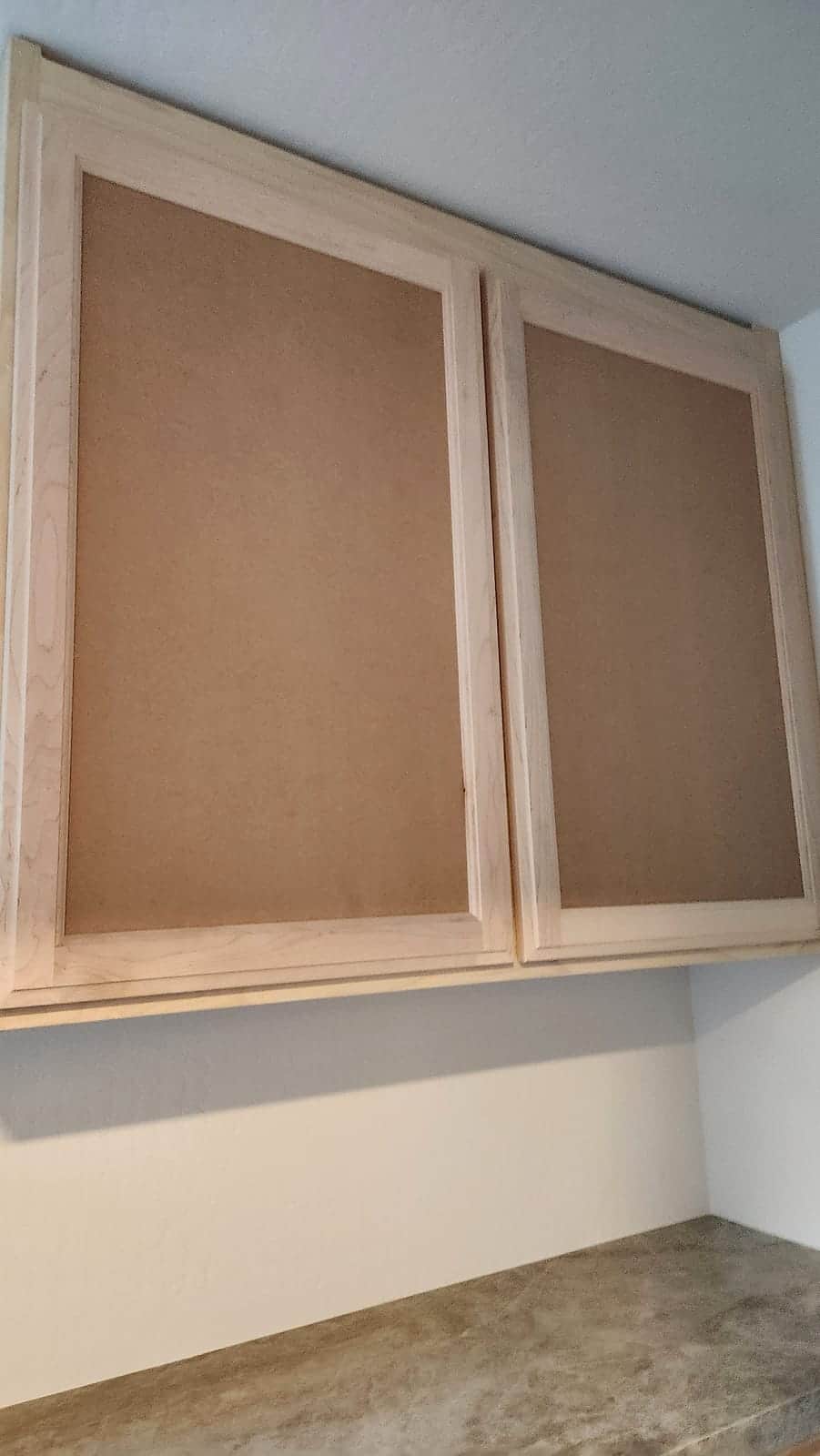 Upper cabinets primed smooth for a factory-like finish