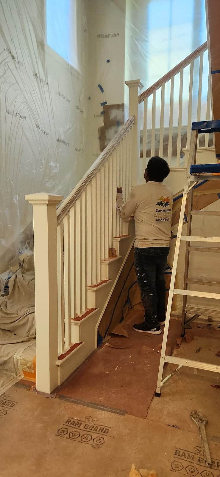 Rolling out a two-story stairwell with walls masked off